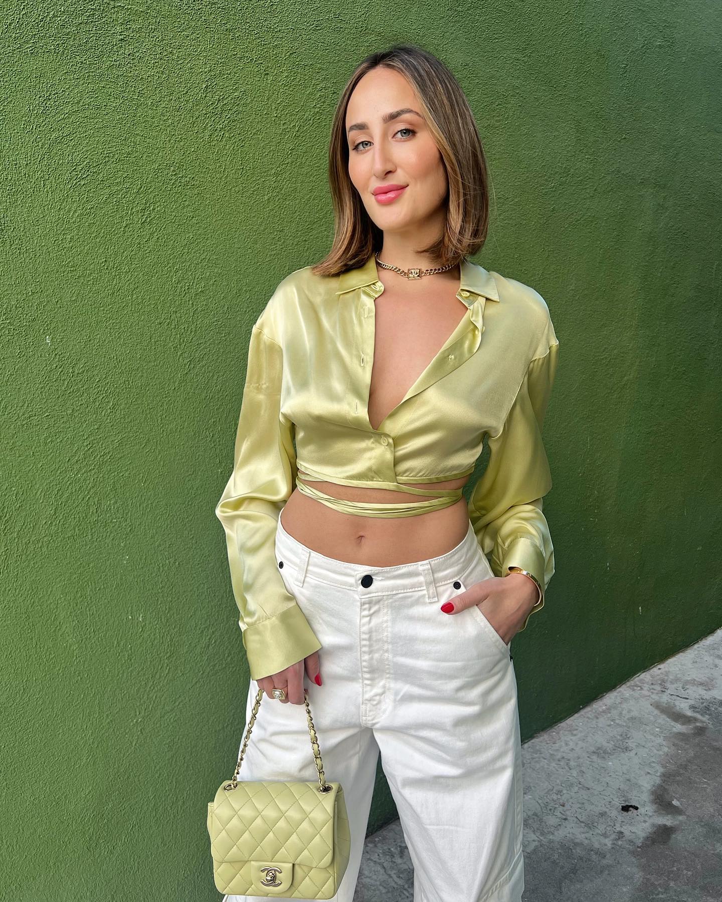 woman in green wit short hair