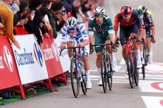 Remco Evenepoel leads Kaden Groves and Filippo Ganna in the late attack during stage 21 of the 2023 Vuelta a España