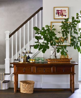 hallway console with stairs, bar and branches