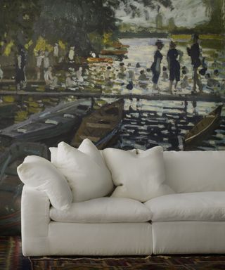 Painted mural in a living room with a white sofa