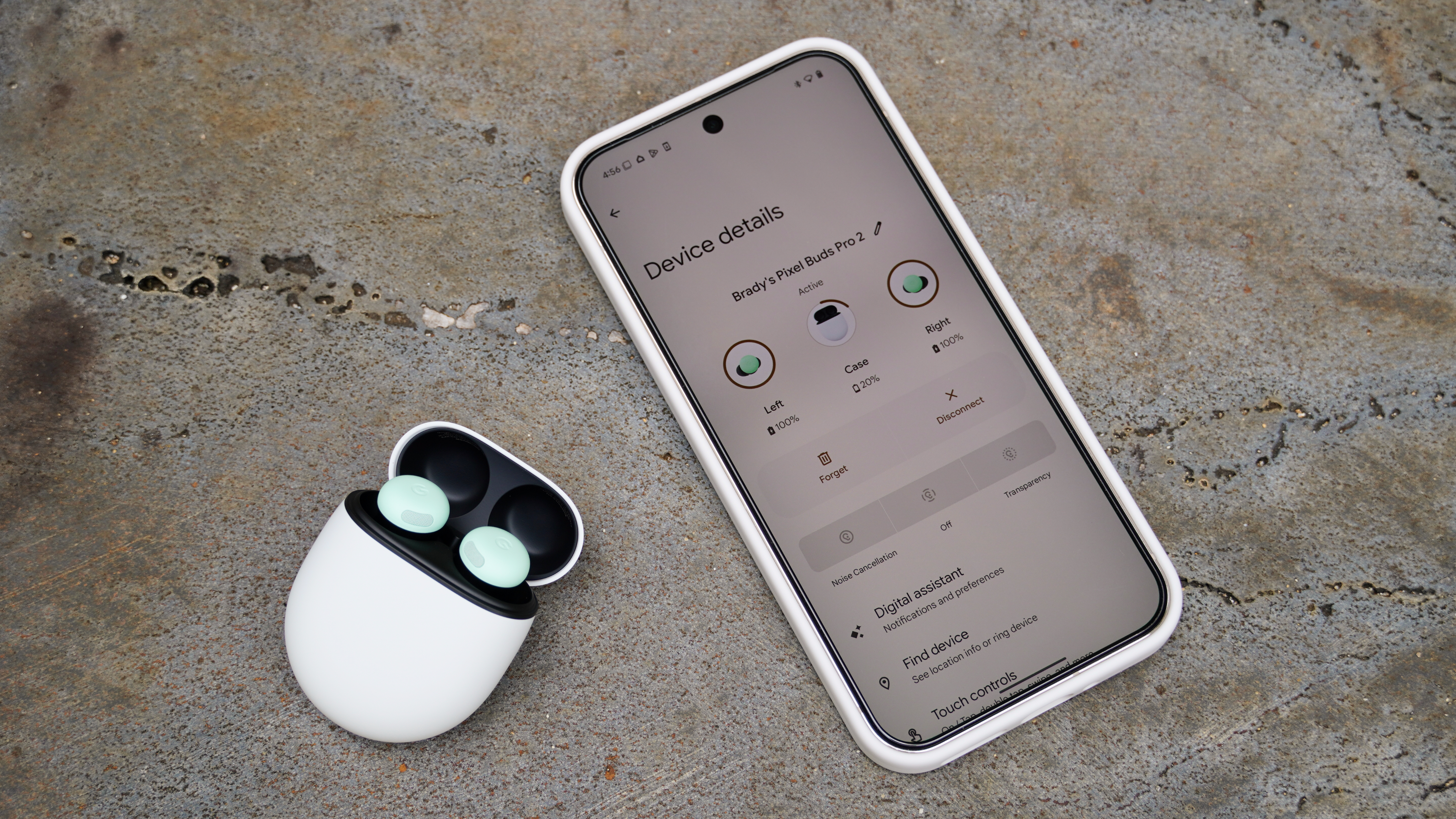 The Google Pixel Buds Pro 2 in the Mint colorway next to the Pixel Buds companion app.