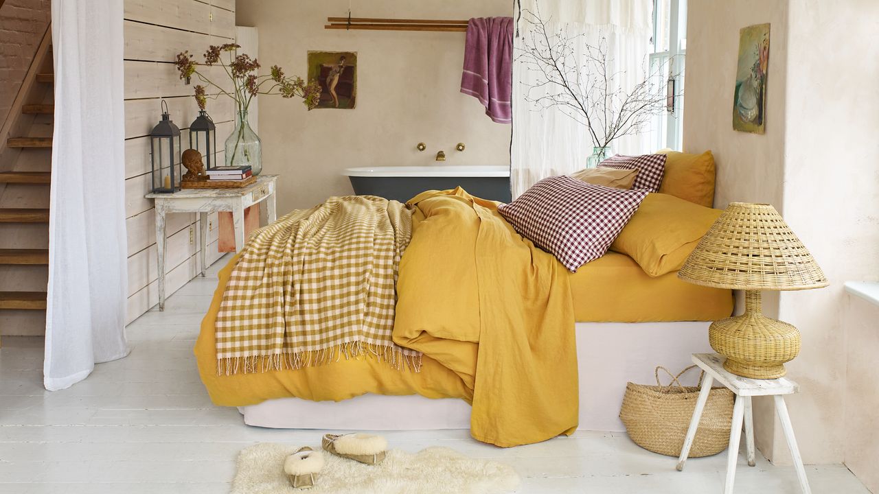 yellow bedding on in pink bedroom