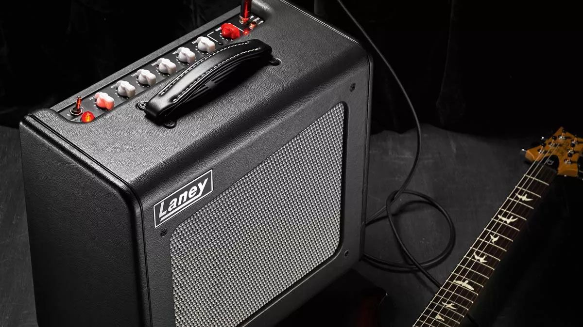 A Laney tube amp with a PRS guitar lying down in front of it