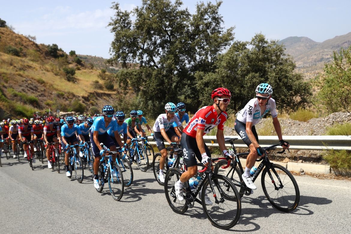 Vuelta leader Michal Kwiatkowski rides alongside teammate Tao Geoghegan Hart