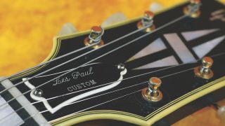 Neck of Gibson’s “Black Beauty” Les Paul Custom electric guitar