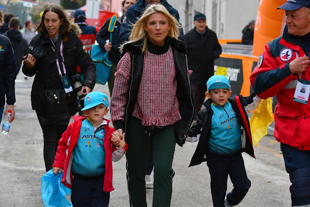 Anna Scarponi and her sons walk to the podium presentation after stage 5 at Tirreno-Adriatico