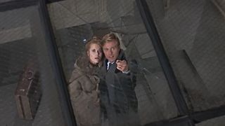 Robert Redford and Jane Fonda look up to a hole in their ceiling in Barefoot in the Park