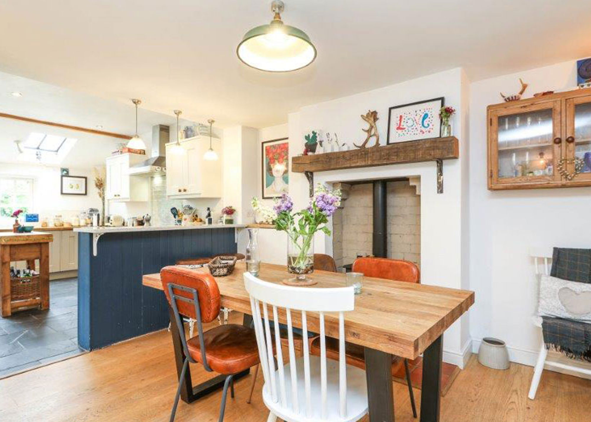 open-plan kitchen diner with blue breakfast bar