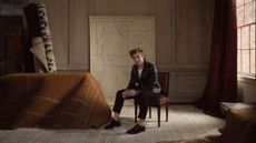 Interior designer Jeremiah Brent poses with his new Loloi collaboration 