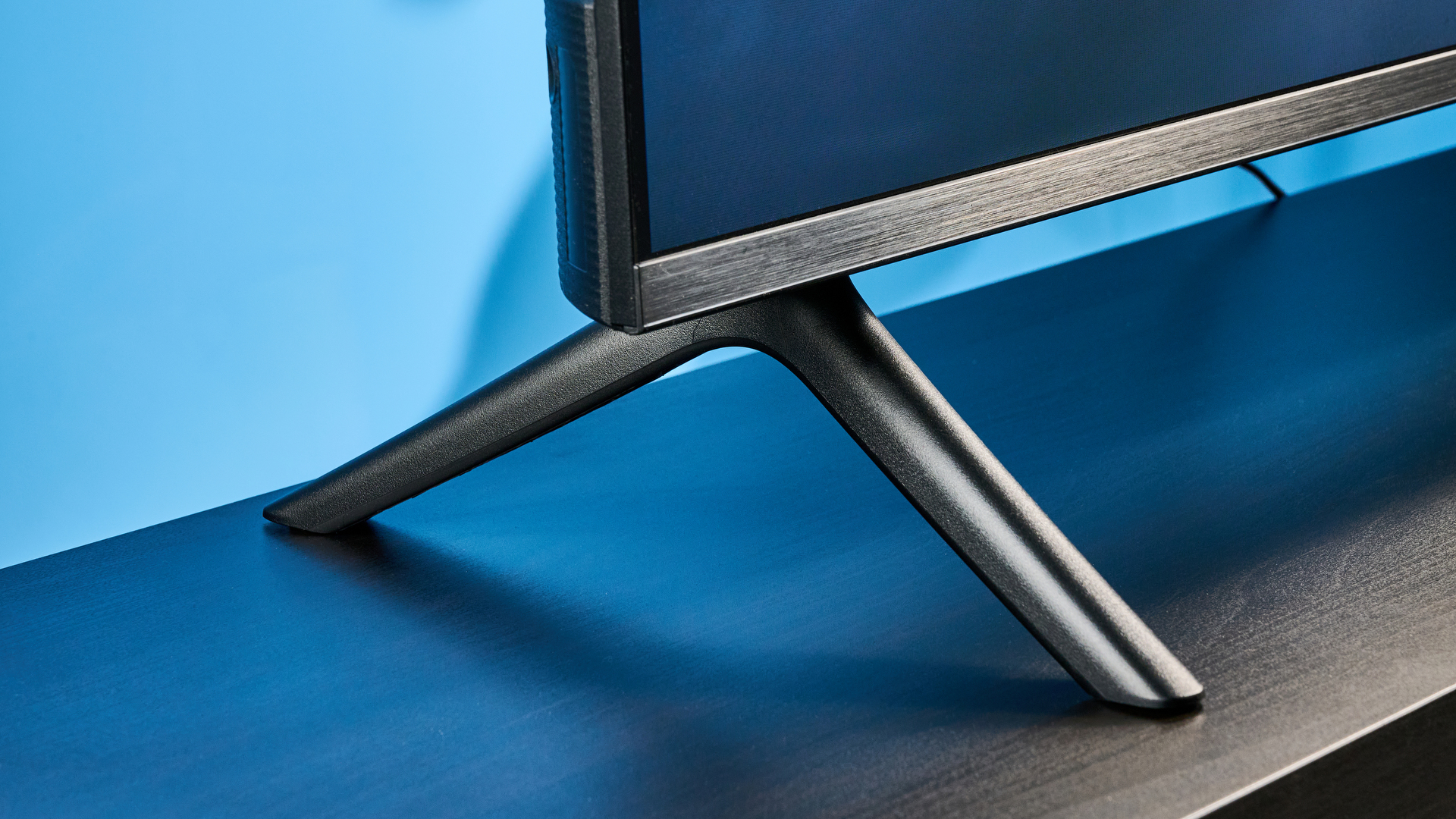 the amazon ember 4-series TV photographed against the blue tom's guide background