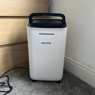The ElectriQ 12L dehumidifier with the carry handle raised