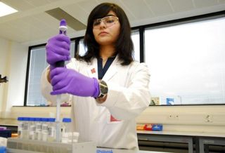 A lab technician analyzes samples in an anti-doping test.