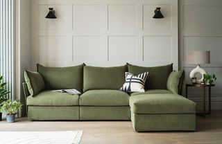 A modular chaise sofa in green upholstery