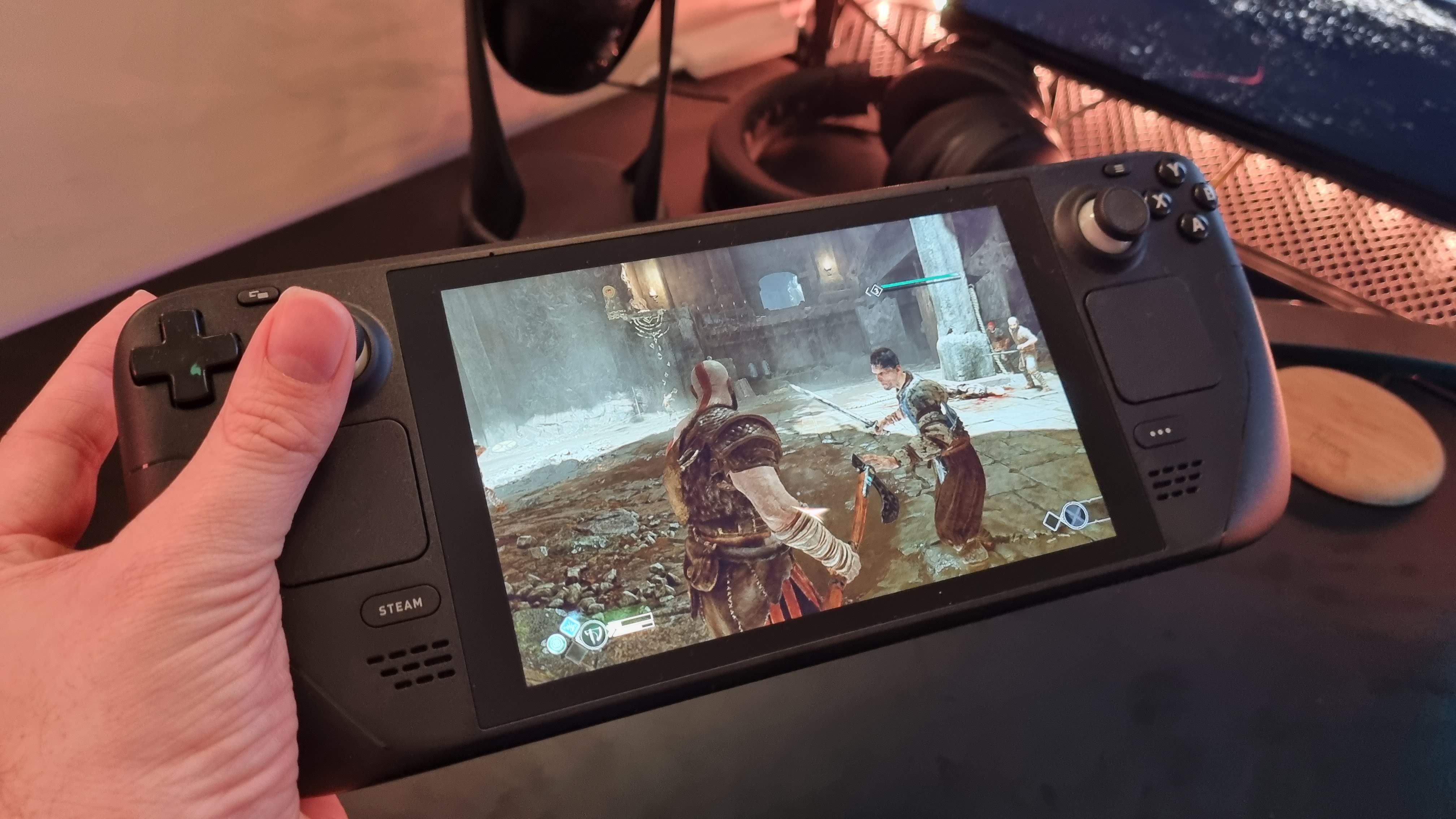 Photo of Steam Deck handheld console playing God of War