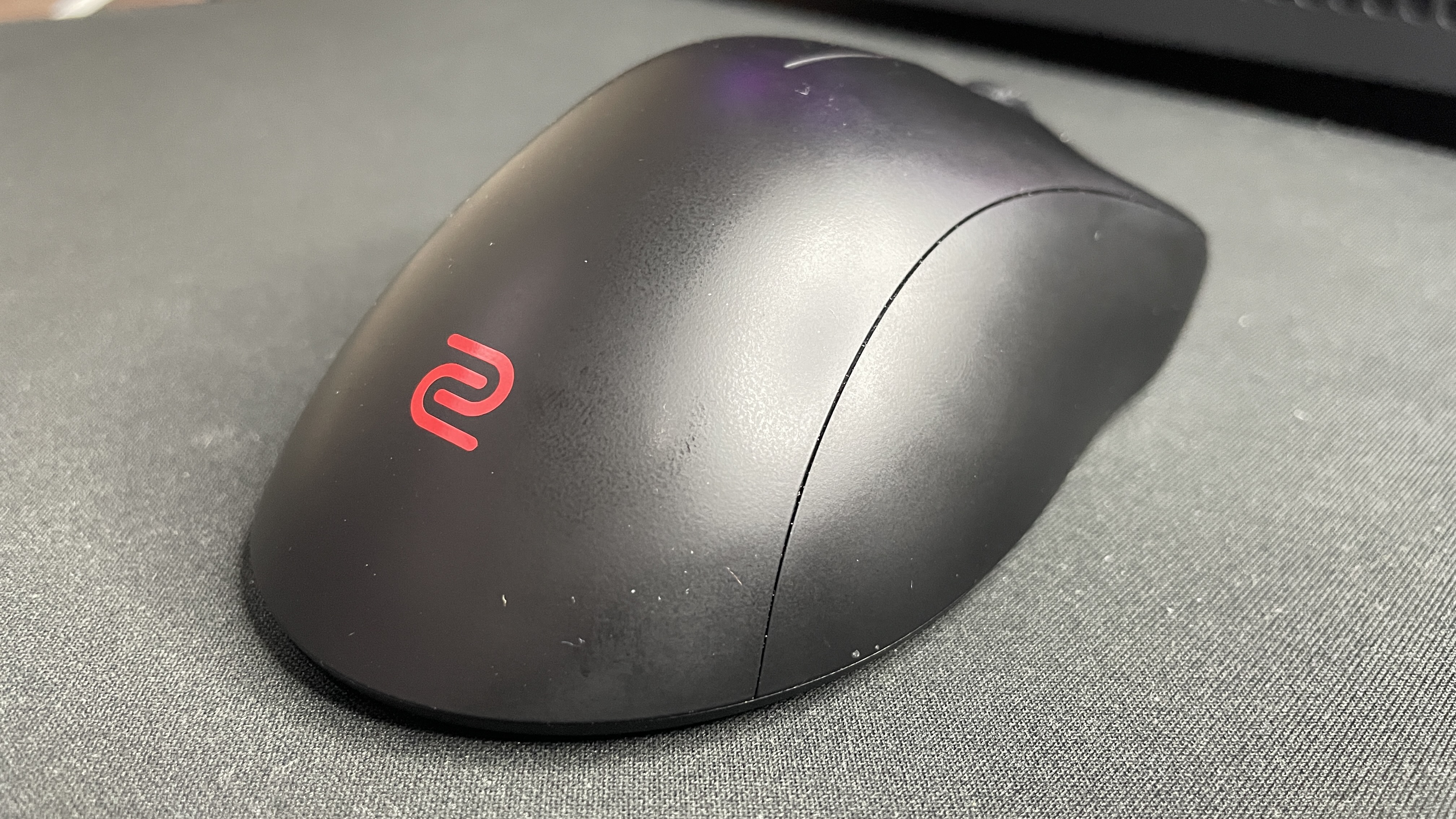 A Zowie EC2-DW gaming mouse.