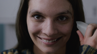 Caitlin Stasey as Laura Weaver smile death Smile 2022 movie