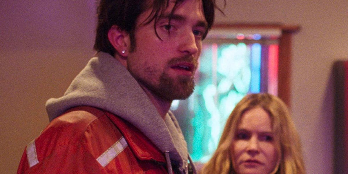 Good Time Robert Pattinson and Jennifer Jason Leigh waiting in the pawn shop