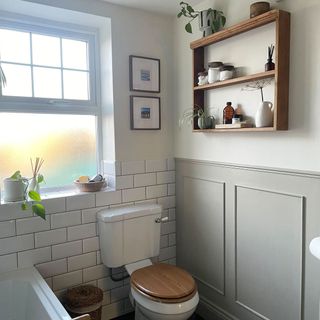 Bright airy bathroom with metro tiling and built-in storage
