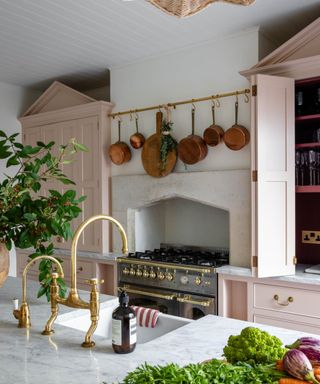 kitchen with a pan rail and copper pans