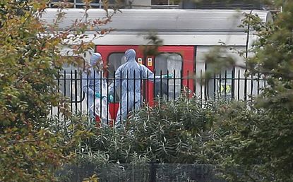 Investigators at the Parsons Green Tube station