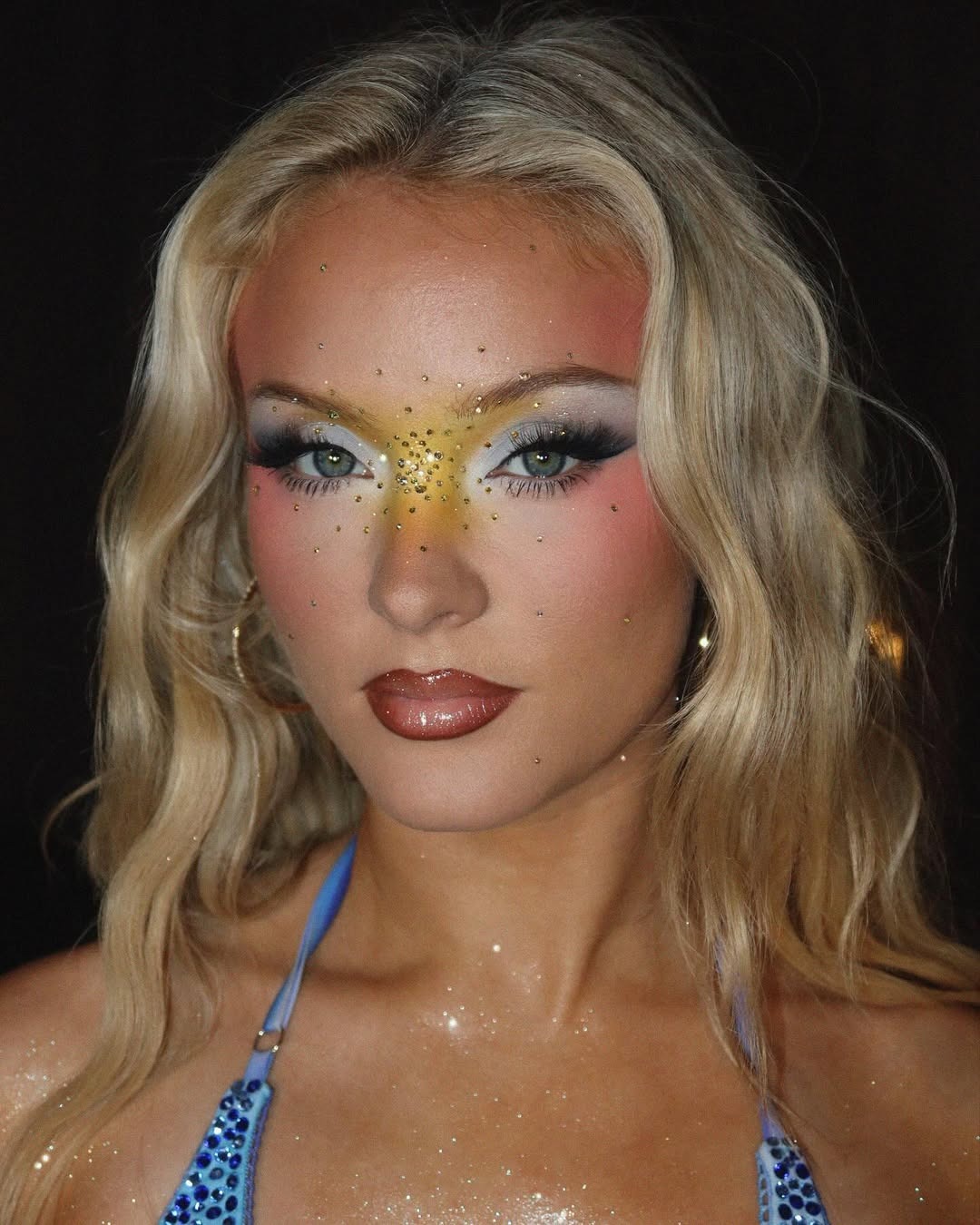 An image of singer Zara Larsson wearing editorial eye makeup.