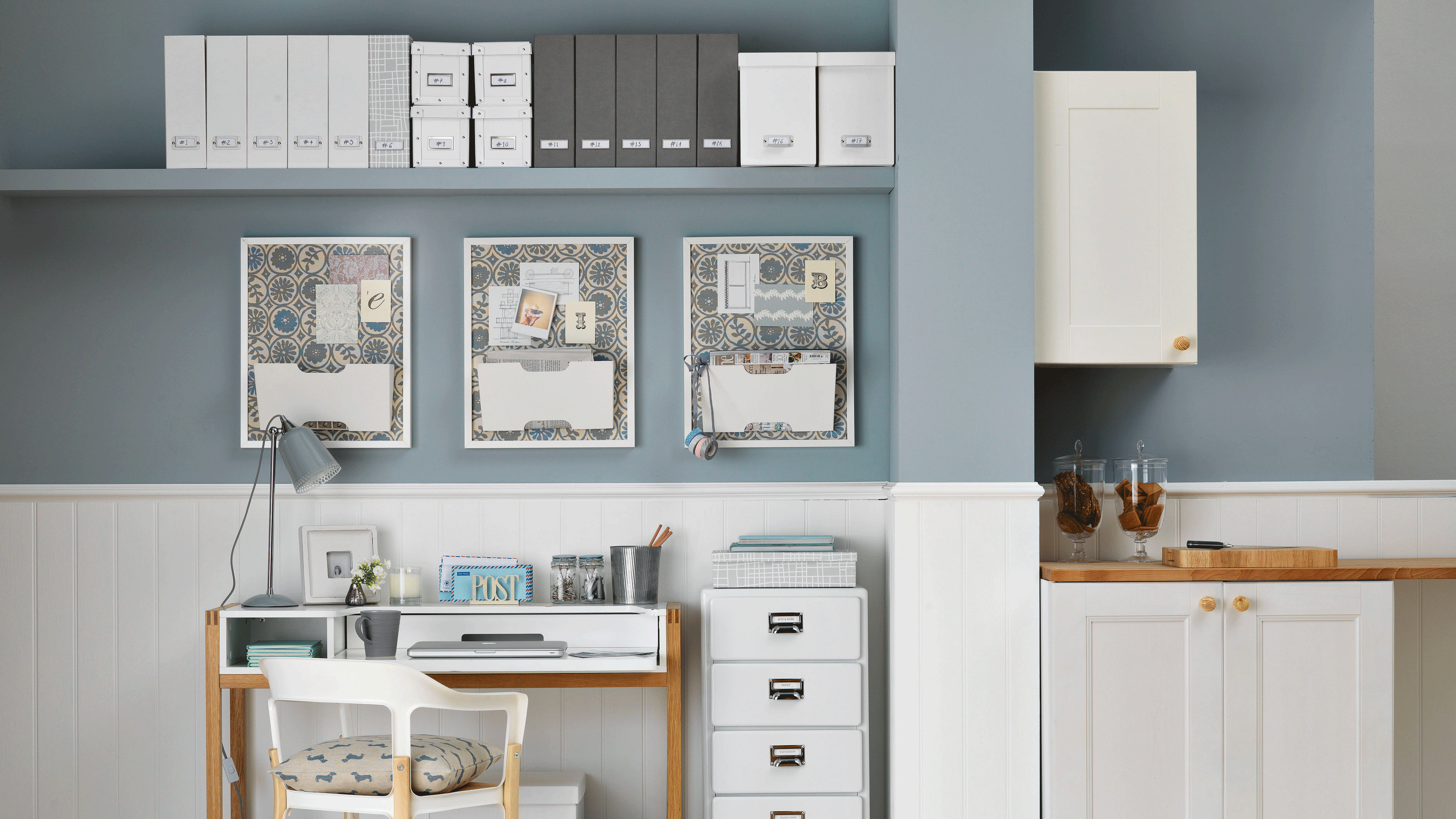 Grey and white desk in open plan kitchen