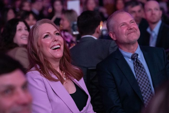 Honoree Annie Howell, chief communications officer at Hallmark Media, watches from the audience.