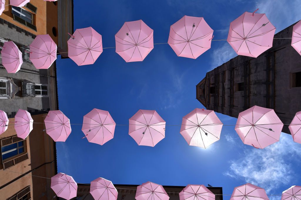 CUNEO ITALY JULY 02 Pink umbellas decoration at start during the 32nd Giro dItalia Internazionale Femminile 2021 Stage 1 a 267 Individual Time Trial stage from Fossano to Cuneo 540m GiroDonne UCIWWT on July 02 2021 in Cuneo Italy Photo by Luc ClaessenGetty Images