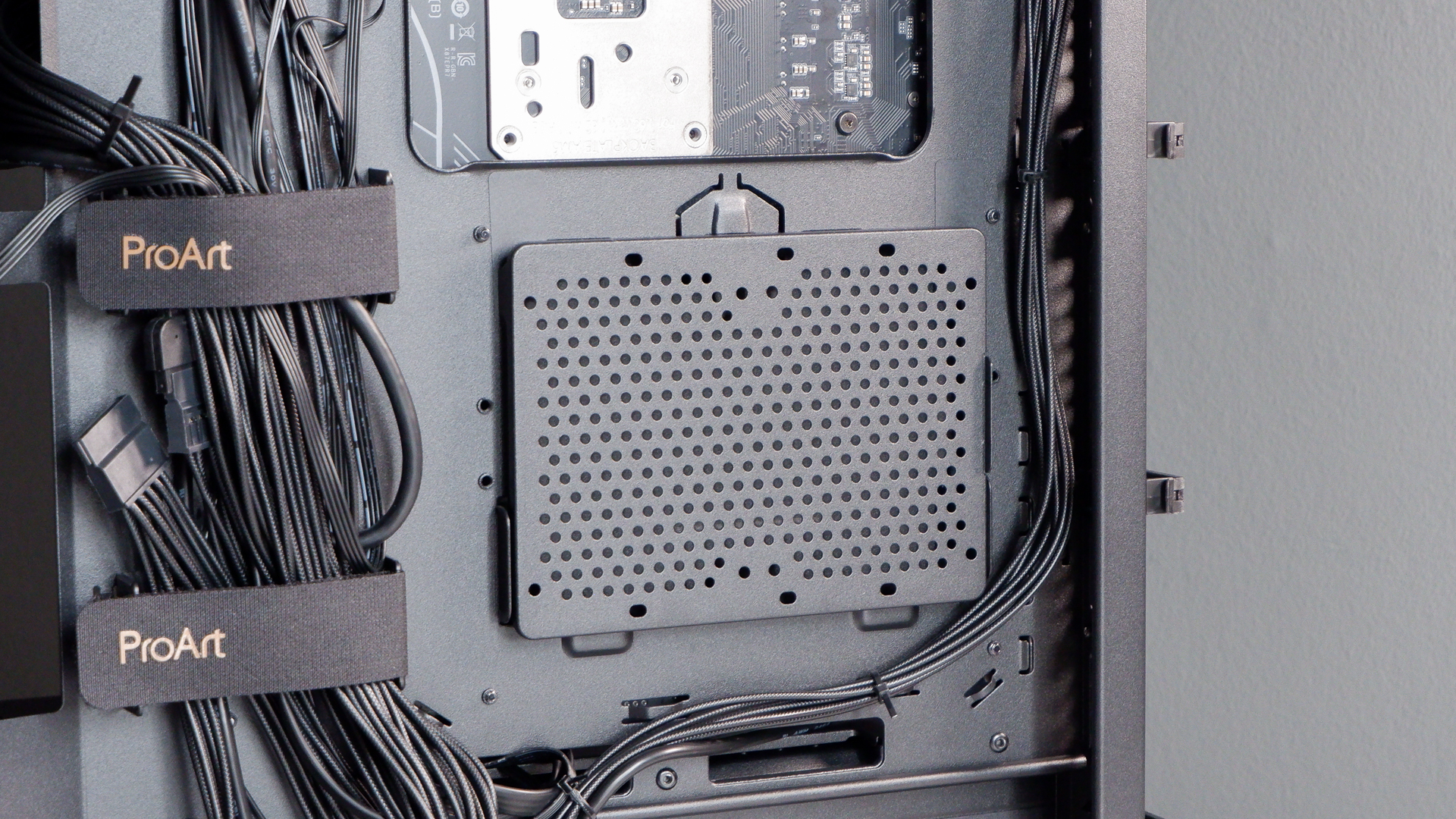 A gaming PC in the process of being built, using Radeon and Ryzen components and an Asus Pro Art PA401 PC case.