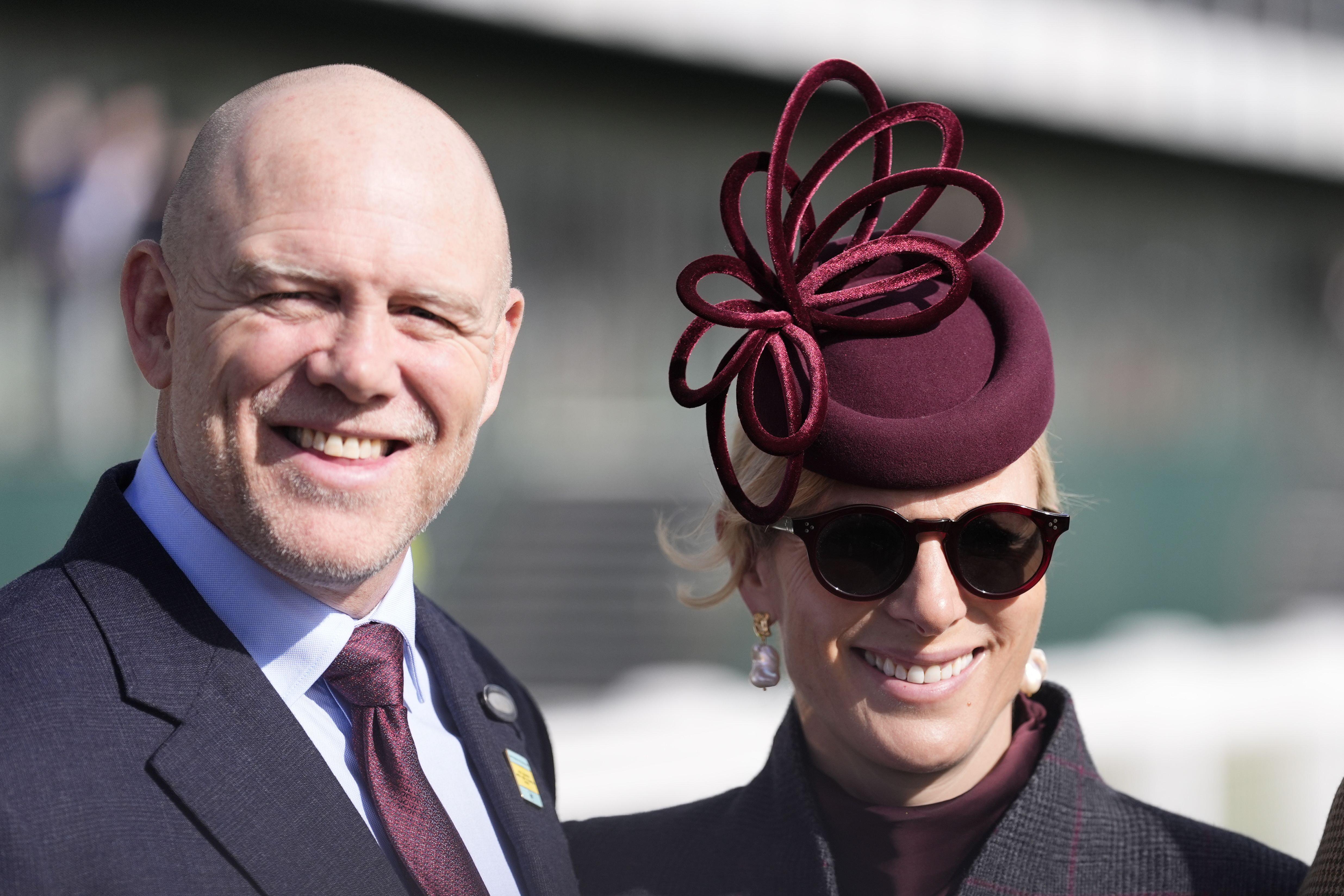 Zara and Mike Tindall smiling at the Cheltenham races