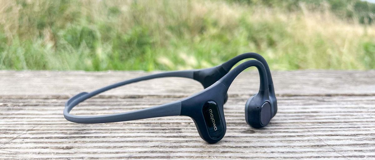 Mojawa Run Plus bone-conduction headphones on wooden bench outdoors 