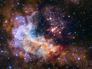 In 2015, NASA's Hubble Space Telescope celebrated its 25th year in space. To celebrate, NASA unveiled this view of the star cluster Westerlund 2 and gas cloud Gum 29.