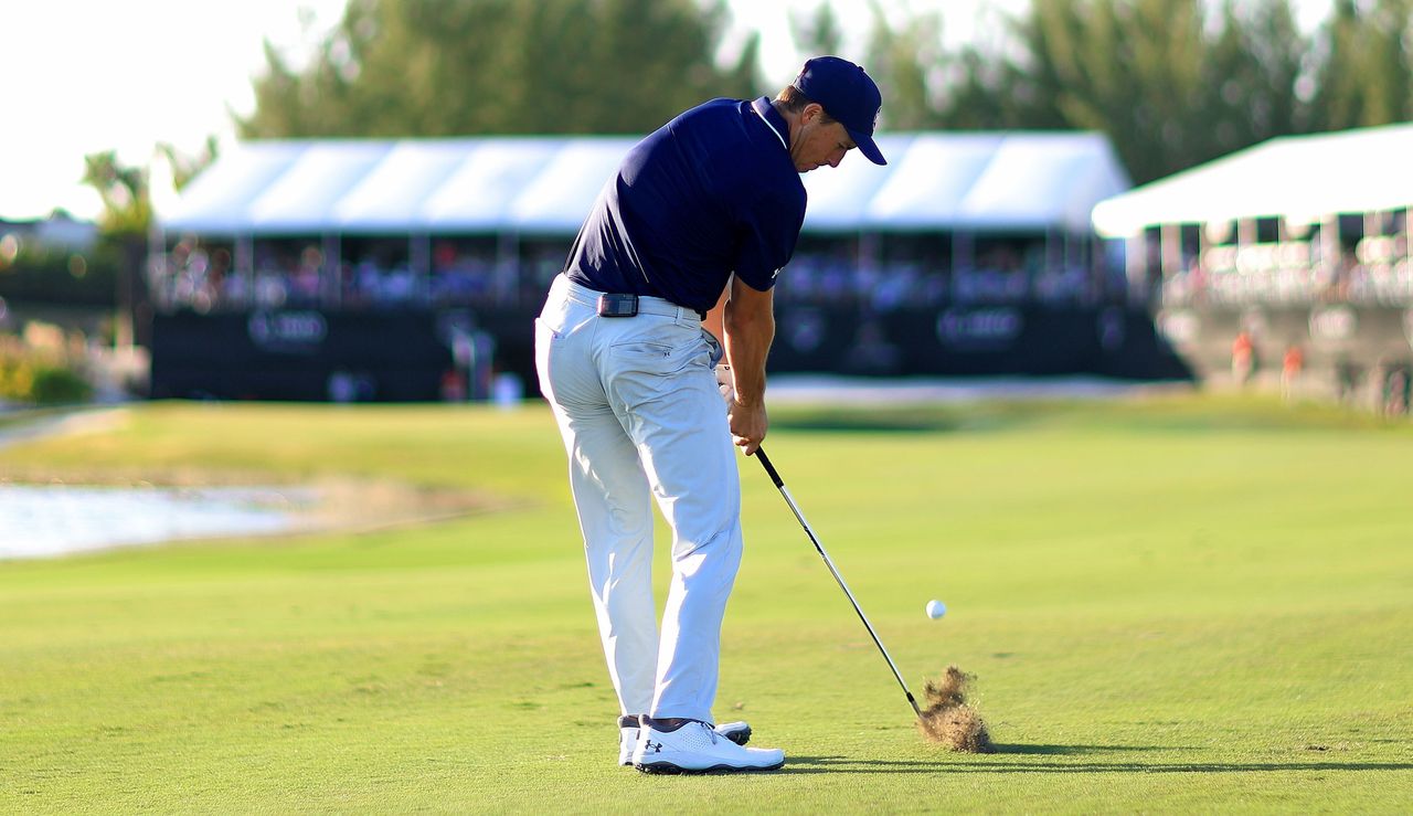 Jordan Spieth hits an iron shot from the fairway