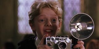 Colin Creevey with his camera in Harry Potter and the Chamber of Secrets
