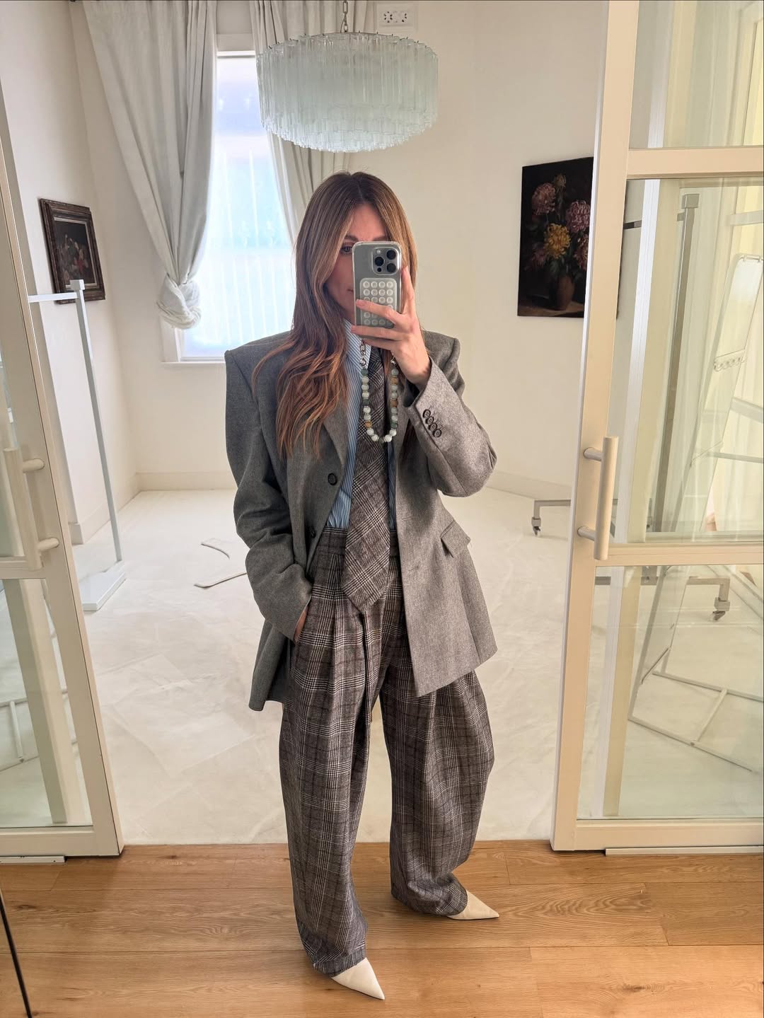 Erin Deering wearing a two-piece checkered suit and tie