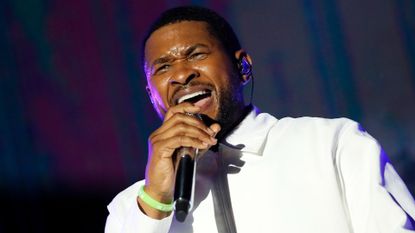 Usher performing