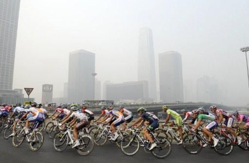 The riders race through the smog in Beijing