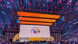 The keynote stage at Google Cloud Next 2024, with the Google Cloud Next logo shown on a huge white screen flanked by orange LEDs. The venue is the Michelob Ultra Arena, at Mandalay Bay in Las Vegas.