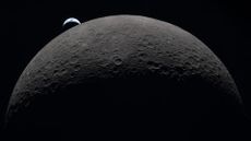 Earth sets from behind the moon.
