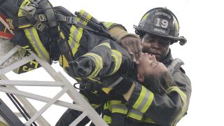 Dean Miller performs CPR on Victoria Hughes (Vic) on a ladder on Station 19.