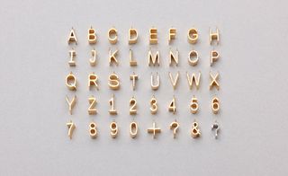 Alphabet pendants by Jacqueline Rabun