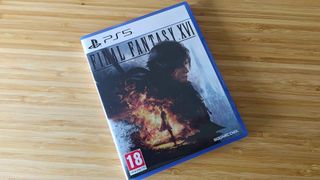 Final Fantasy 16 for PS5 sitting on woodgrain surface