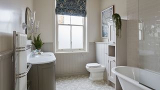 neutral bathroom with rolltop bath