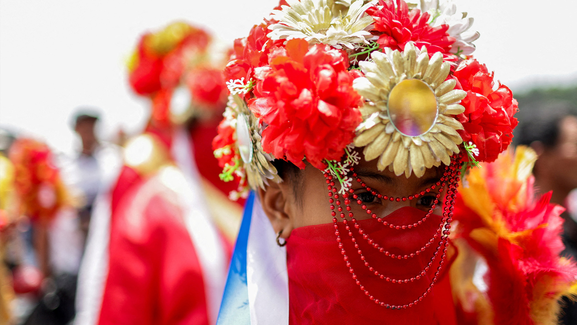 Pilgrims dressed in traditional dance costumes arrive for the mass held by Vatican Secretary of State Pietro Parolin at the Basilica of Our Lady of Guadalupe, in Mexico City, Mexico