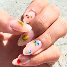 a close up of hailey bieber's farmers market nails