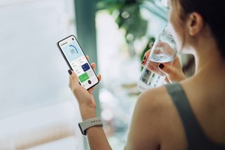 The 4:3 diet: A woman tracks her calories on an app on her phone