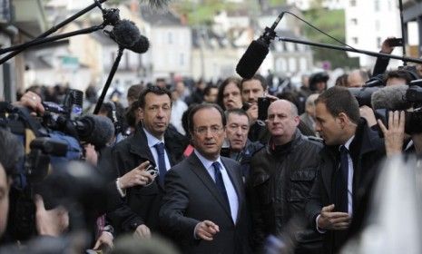 French presidential frontrunner Francois Hollande arrives at a polling station in Tulles to cast his ballot in the first round of elections on Sunday. 