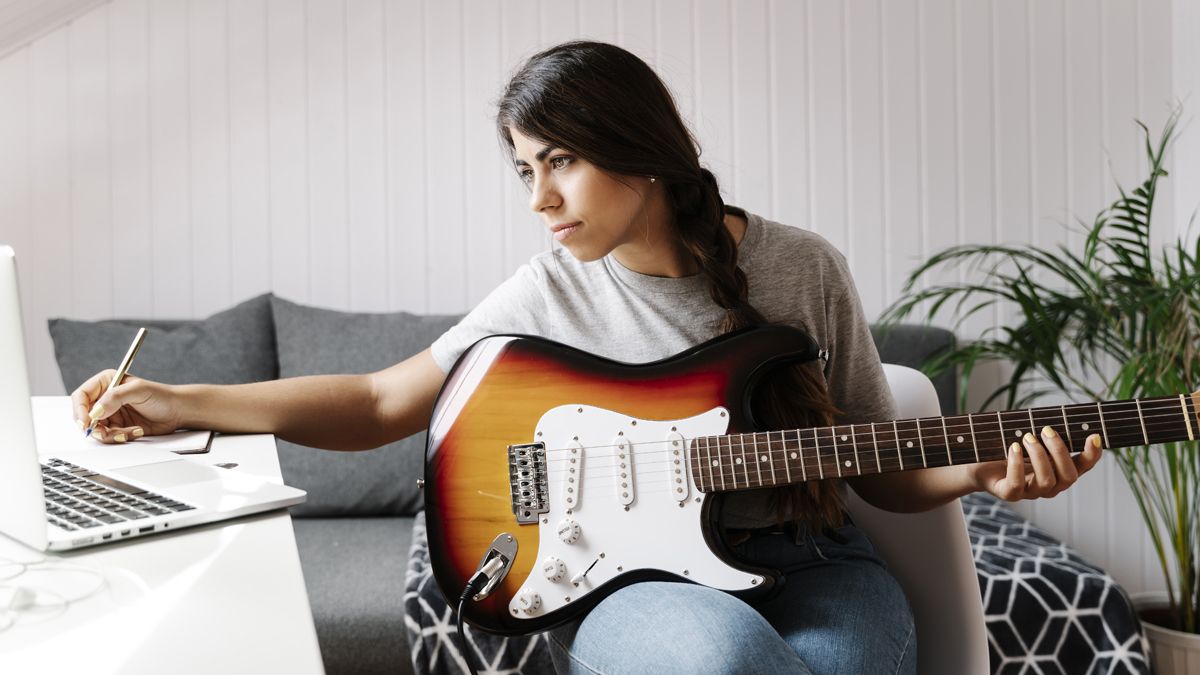 Person playing guitar