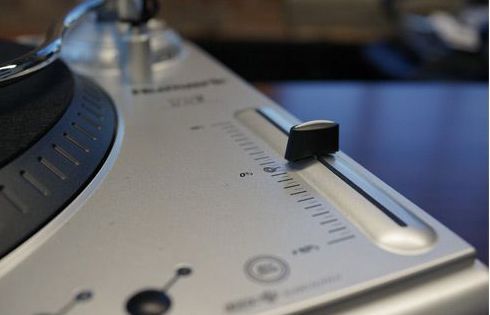 This turntable features a pitch adjustment slider on the tabletop.