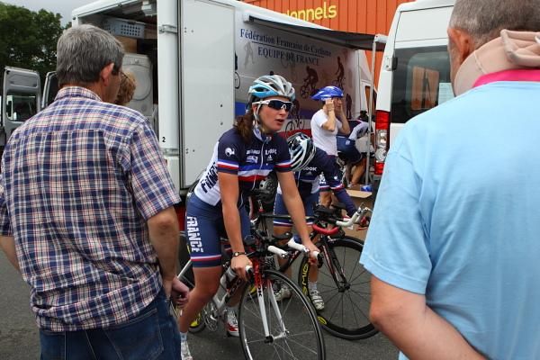 Interested spectators watch the French National team prepare.